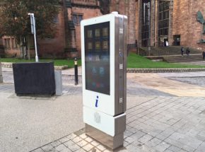 A digital advertising totem displaying in a town centre